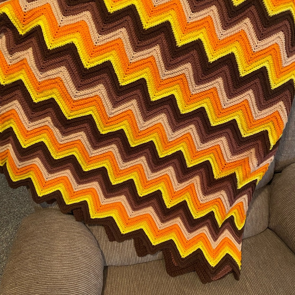 Vintage style Chevron Patterned Throw Blanket in Brown, Orange, and Yellow.
